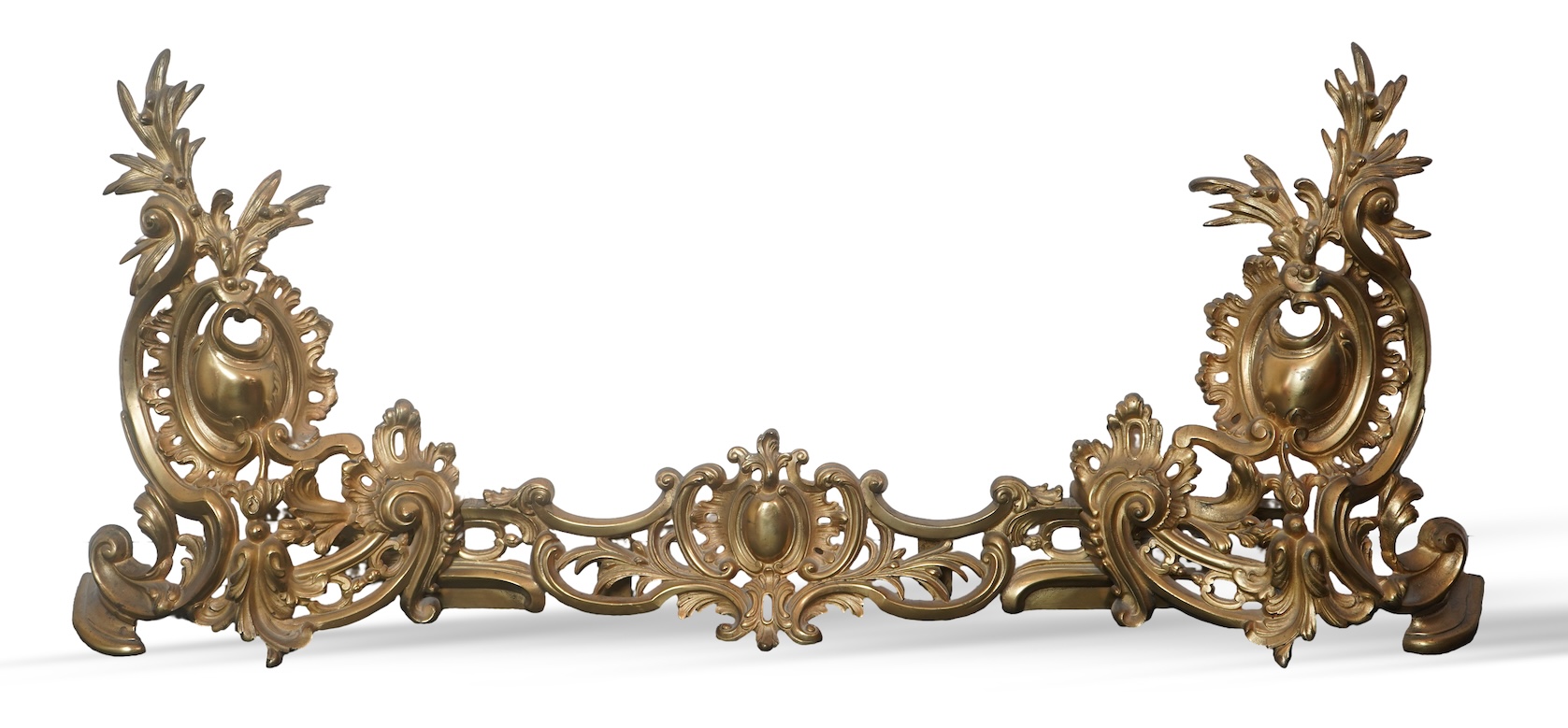 A French rococo revival ormolu adjustable fender with chenets, late 19th century